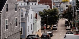 house-and-car-lined street